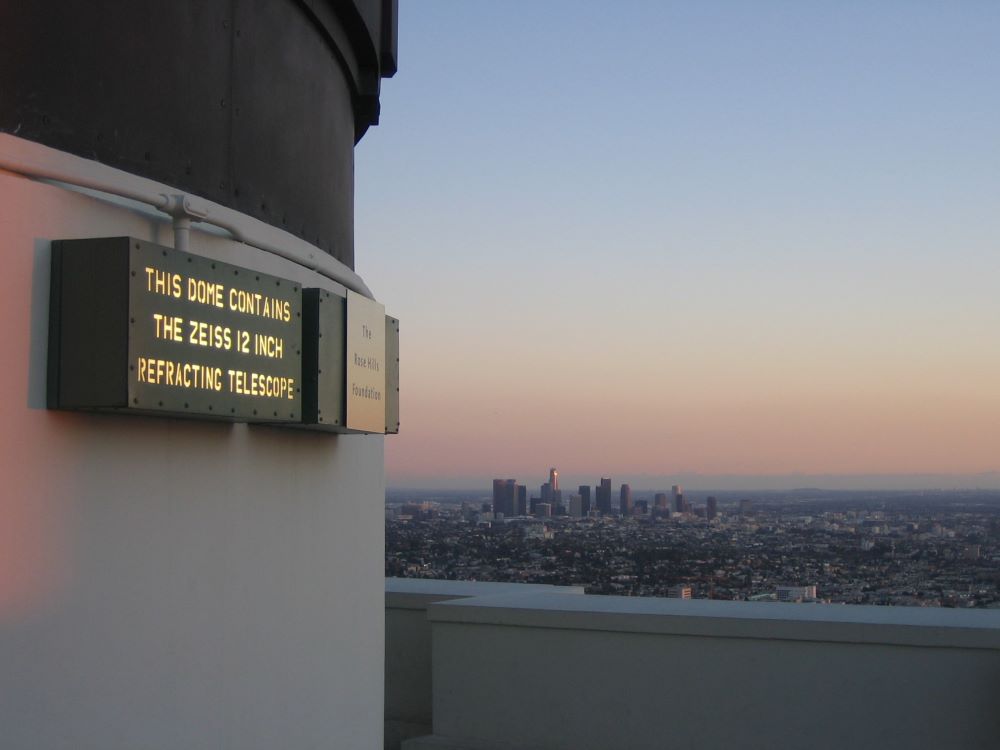 Visitor with telescope at Griffith Observatory, Los Angeles