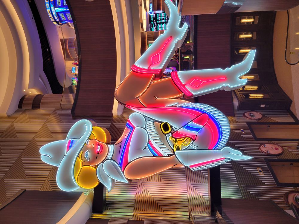 Neon cowgirl sign at Circa Resort and Casino on the Fremont Street Experience in downtown Las Vegas