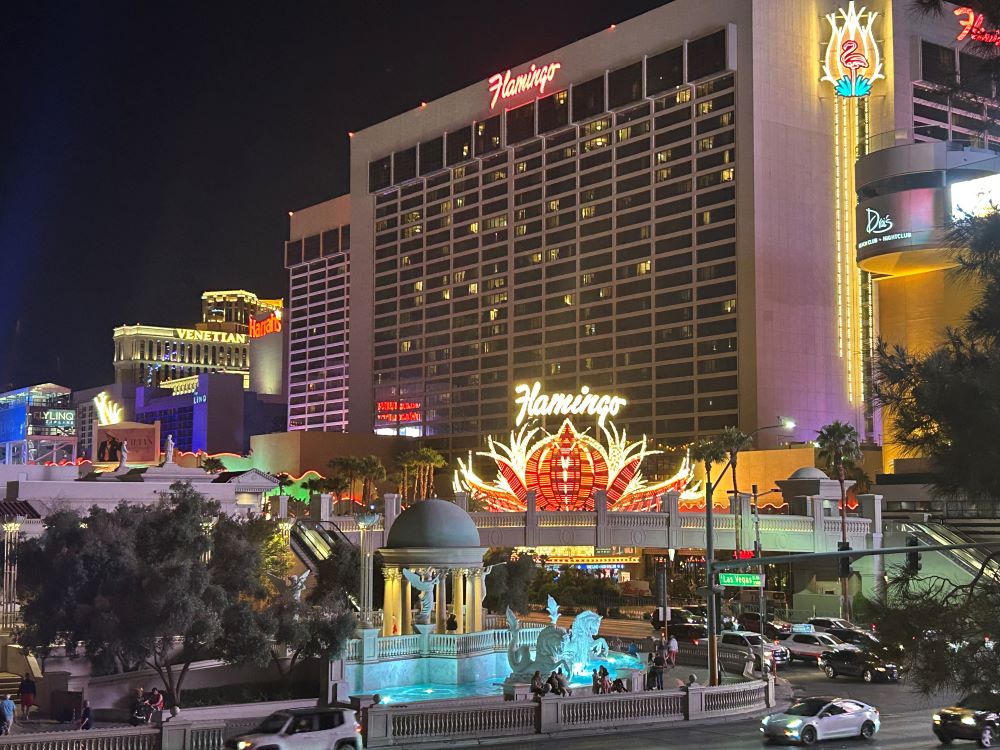 Flamingo Las Vegas hotel illuminated in pink neon at night