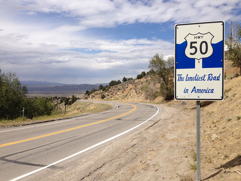 HWY 50 The Loneliest Road in America sign along westbound U.S. Route 50 near Austin, Nevada