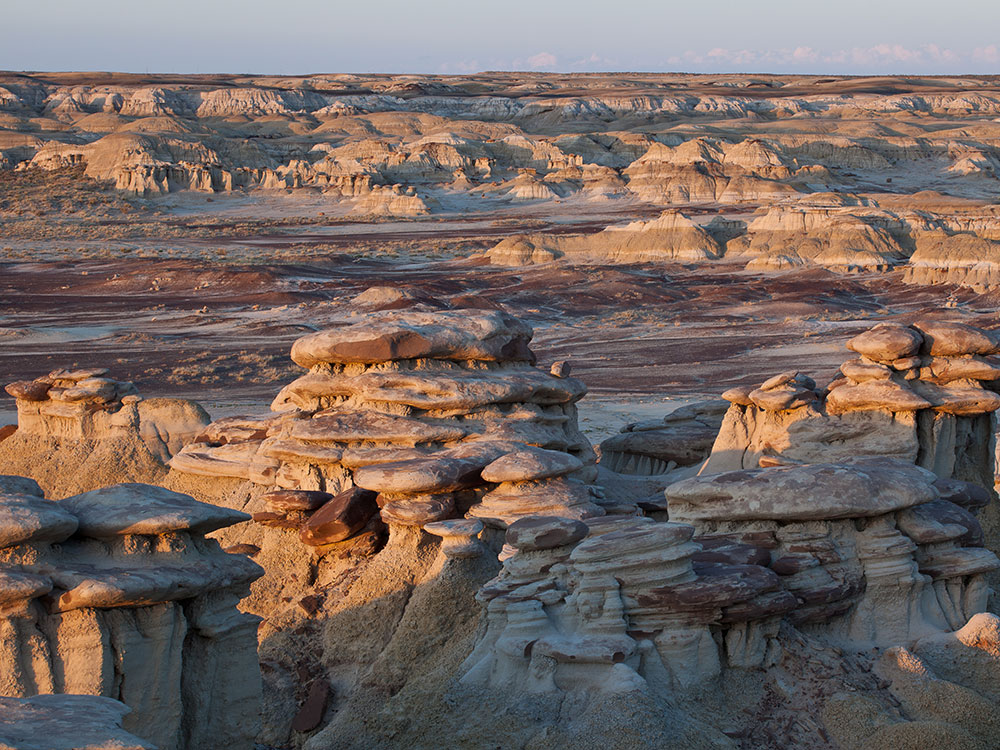 Eroded sandstone hoodoos and desert landscape at Ah-Shi-Sle-Pah Wilderness, New Mexico