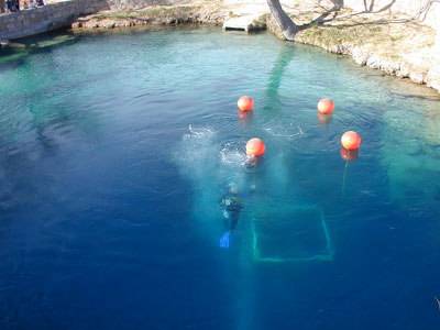 Crystal-clear blue water of the Blue Hole artesian well in Santa Rosa, New Mexico, a popular scuba diving destination on Route 66