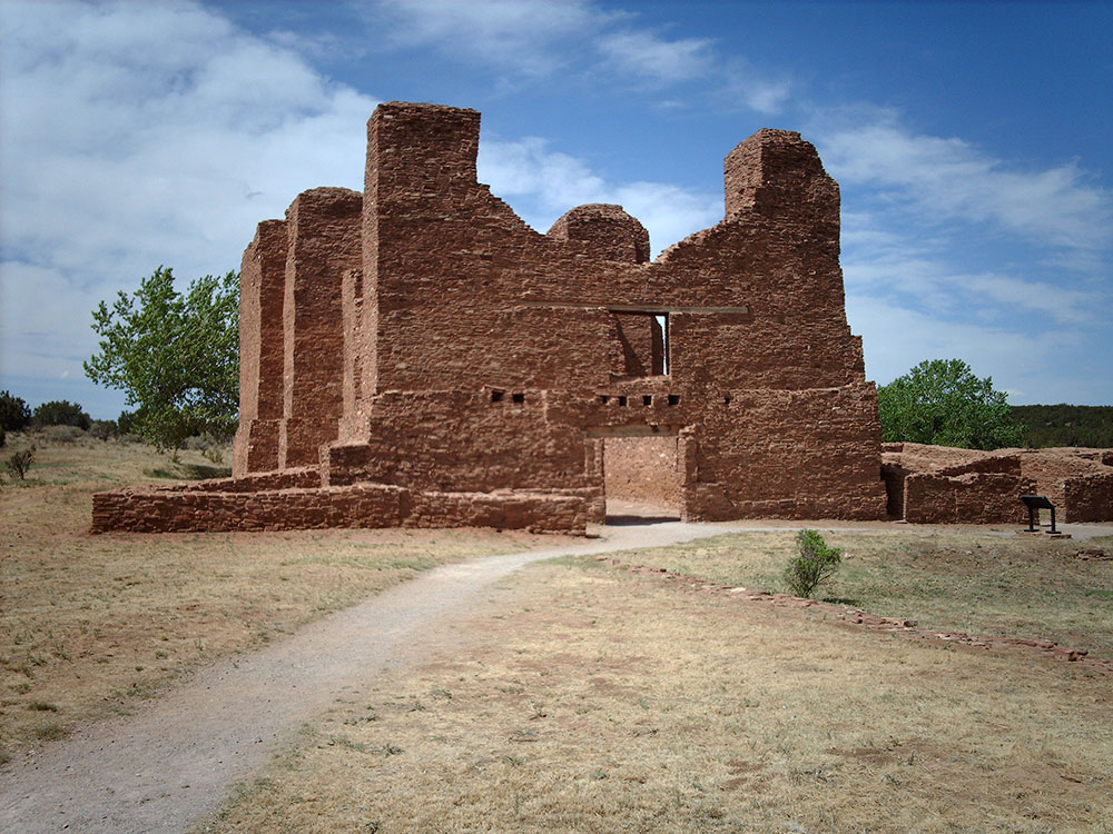 Quarai mission ruins with red sandstone walls and arches in Salinas Pueblo Missions National Monument New Mexico