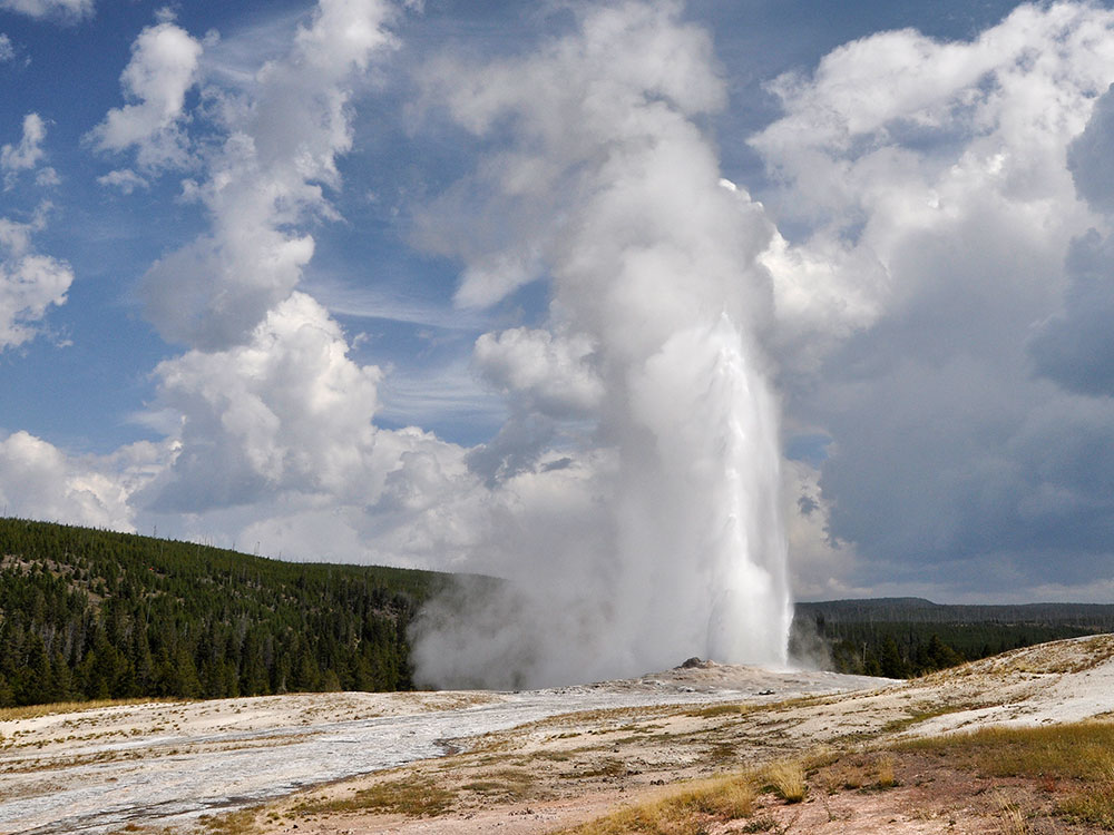 Old Faithful Geyser erupting over the Upper Geyser Basin